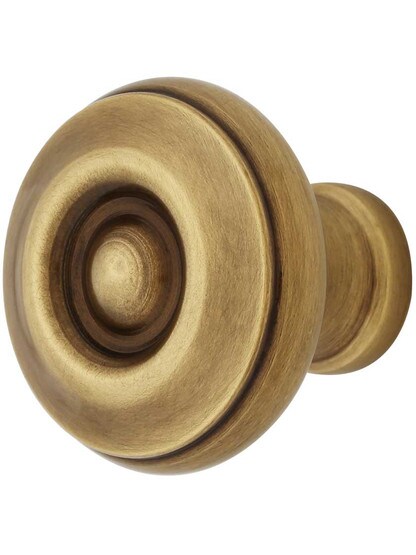 Waverly Cabinet Knob - 1 1/4 inch Diameter in Antique Brass.